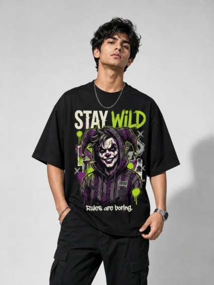 Stay Wild oversized black printed joker graphic t-shirt for men with neon green graffiti design Rules Are Boring - streetwear fashion - Voux.in