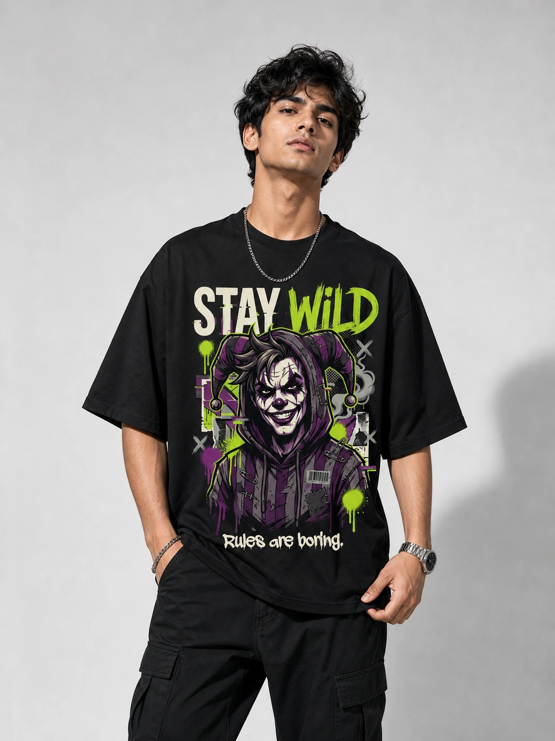 Stay Wild Oversized Printed T-Shirt for Men | Joker Graphic Black Tee | Voux.in Stay Wild oversized black printed joker graphic t-shirt for men with neon green graffiti design Rules Are Boring - streetwear fashion - Voux.in